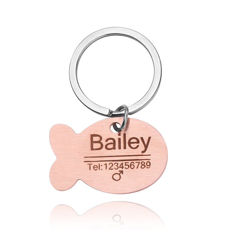 Rose gold pet ID tag engraved with pet name and phone number
