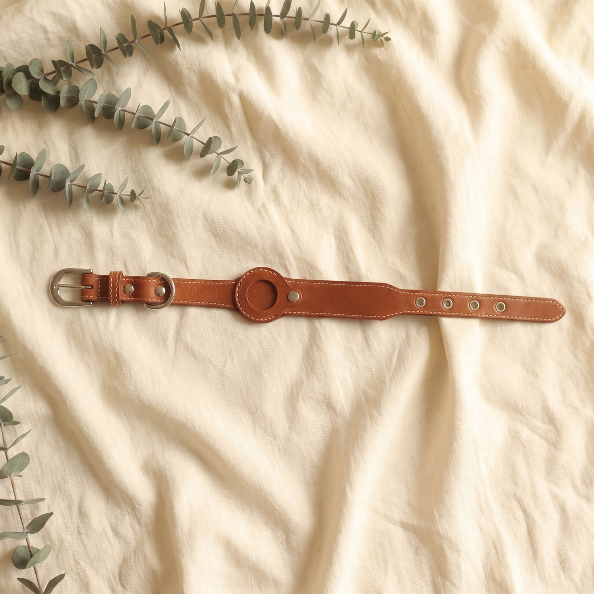 Brown Furmonogram leather dog collar on cream linen