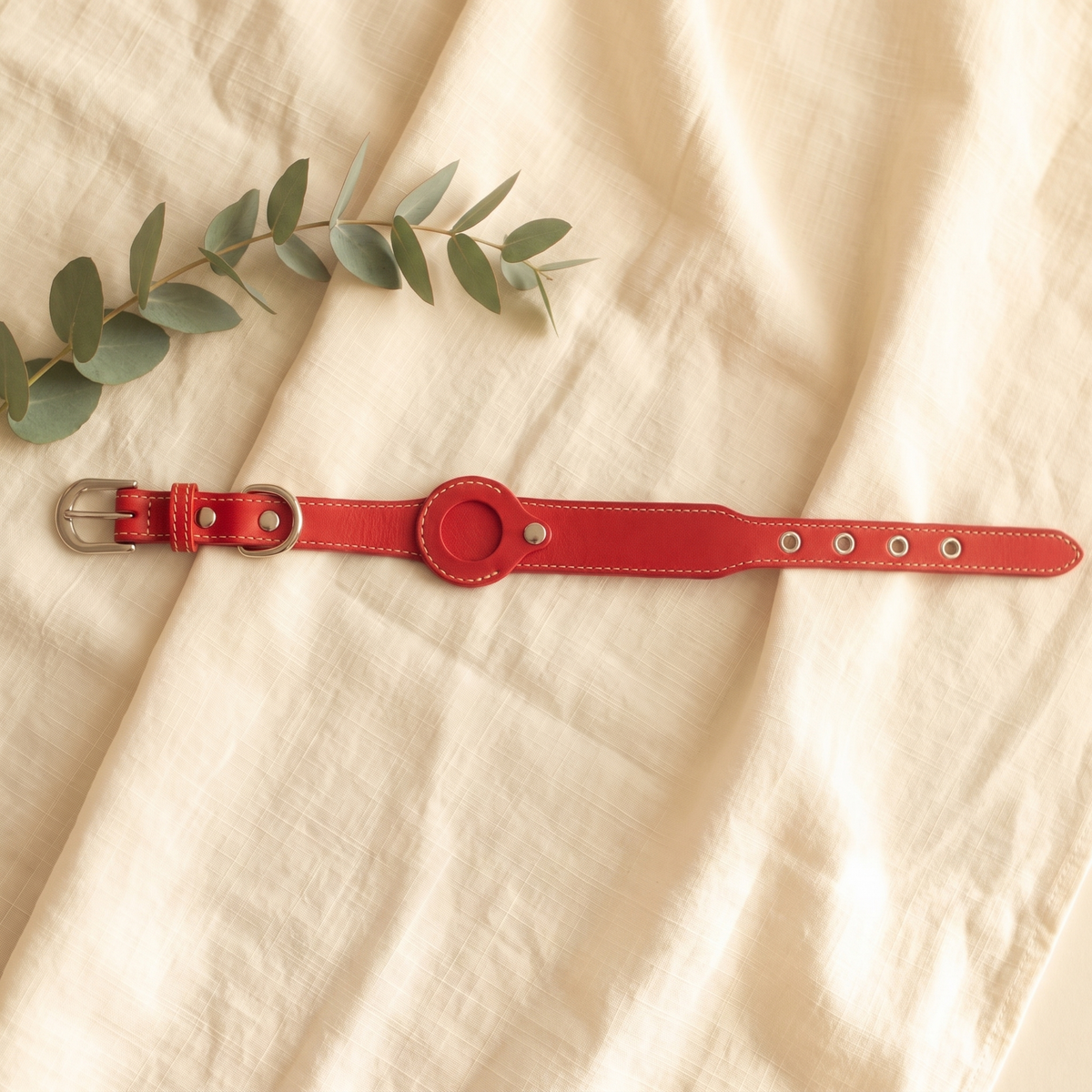Red Furmonogram leather dog collar on cream linen