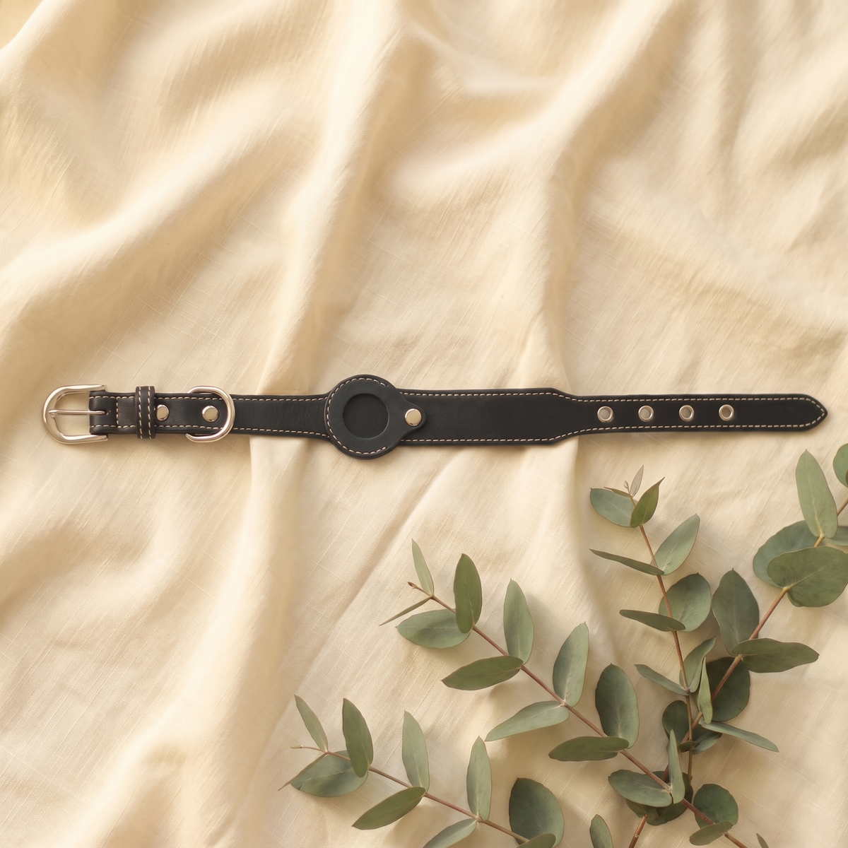Black Furmonogram leather dog collar on cream linen