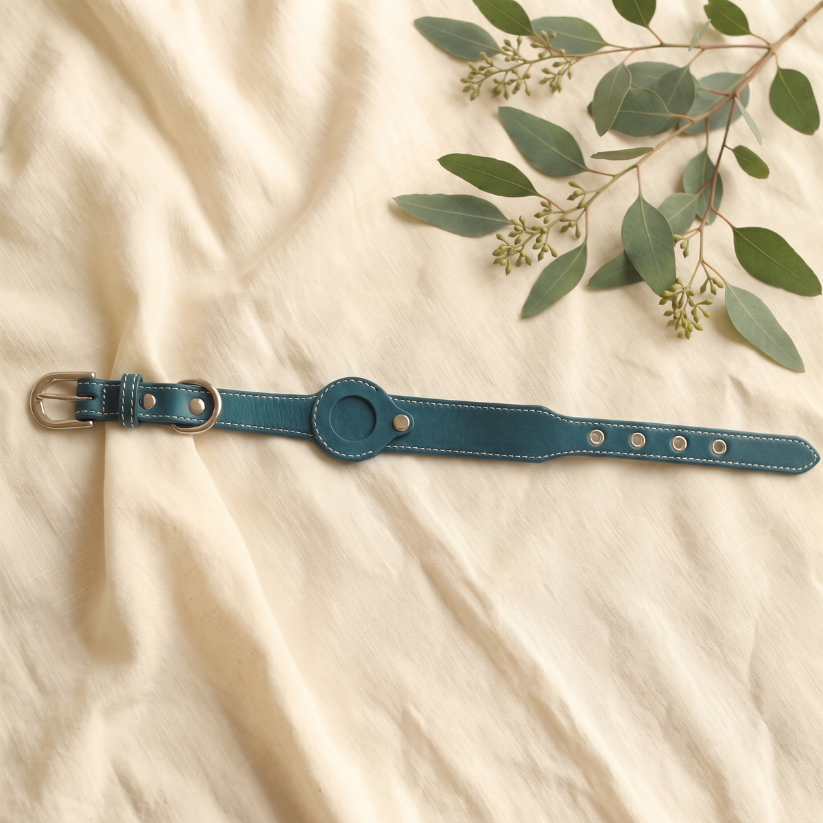 Peacock Blue Furmonogram leather dog collar on cream linen